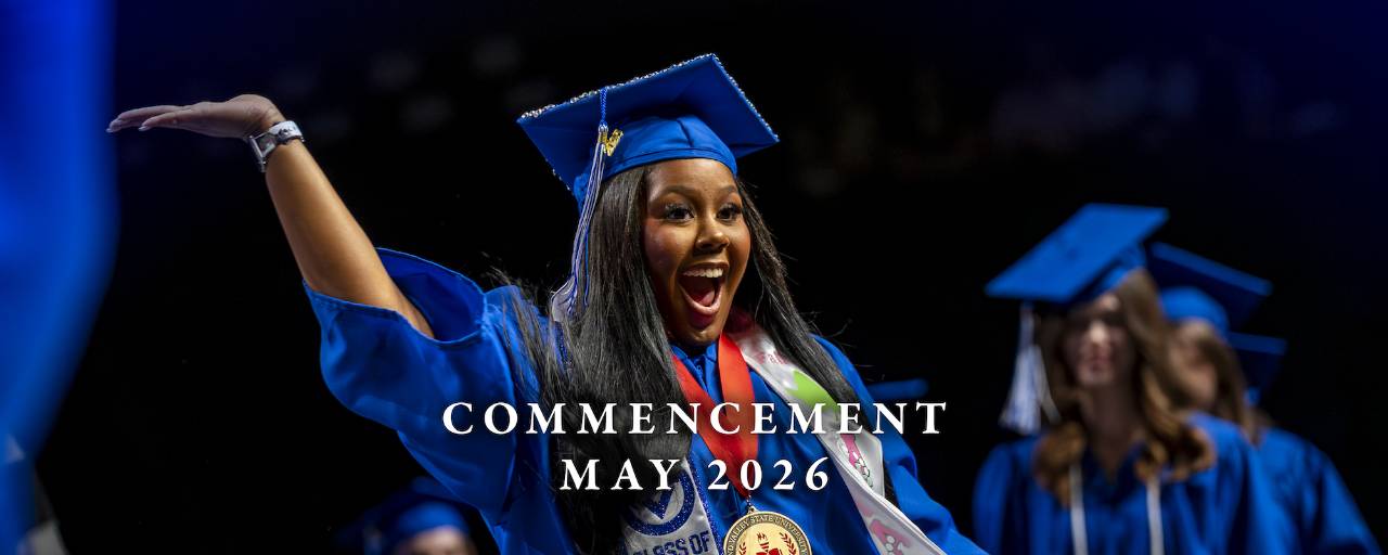 GVSU graduate celebrates on the Commencement stage